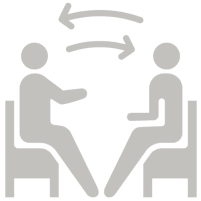 Two figures sitting and exchanging ideas icon.